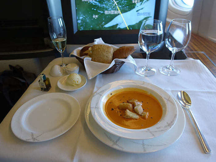 This was followed by a delicious tomato basil soup. The flight attendant even came by with a pepper grinder and asked me how much pepper I would like on top!