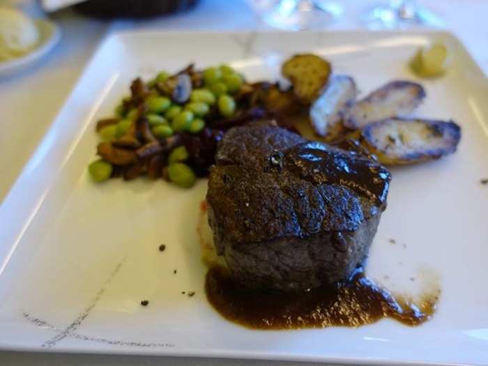 I then proceeded to order the US prime beef fillet. I’ve had a couple steaks on other airlines and each time it has been extremely dry. This time around I ordered my steak completely rare.