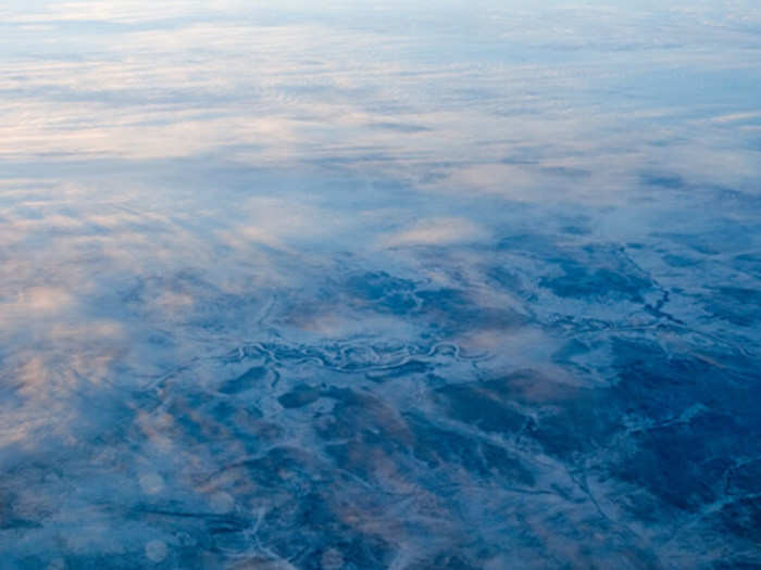 I woke up while we were flying over Russia. The view was absolutely stunning as we flew over rivers of ice.