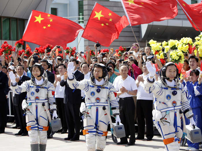 On June 16, 2012, taikonauts Jing Haipeng (right), Liu Wang (center) and Liu Yang (left) were sent off in style from the Jiuquan Satellite Launch Center in Gansu province.