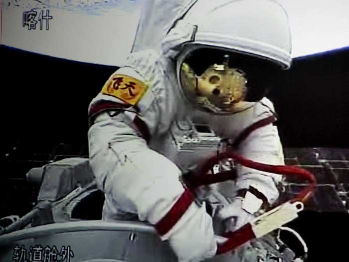 Here, a taikonaut has suited up and ventured into the vacuum of outer space to perform maintenance during the Shenzhou-7 mission.