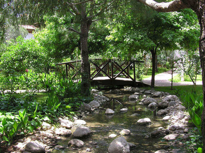 An artificial stream is kept stocked with fish.