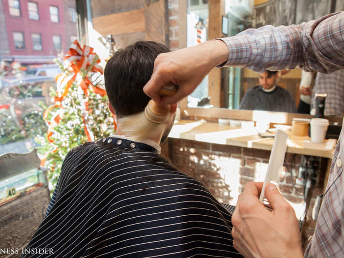 Geno used a straight-edged razor to trim the nape of my neck — a technique I