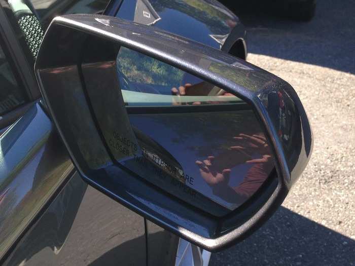 An interesting hexagonal motif recurs throughout the car. Here it is on a side-view mirror.