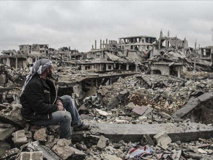 Last year, ISIS militants shocked the world after rampaging through Iraq and Syria. In this March 12, 2015 photo, a man looks at the rubble of buildings destroyed in the clashes between ISIS militants and Kurdish armed armed groups in the center of the Syrian town of Kobani.