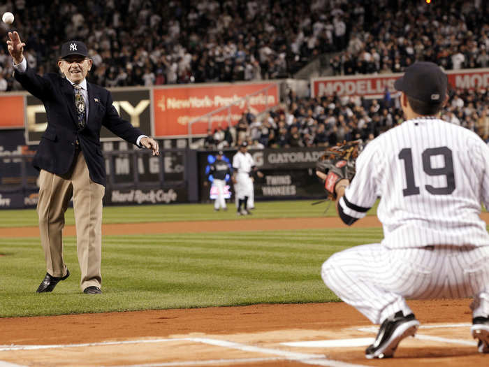 On September 22, former New York Yankees catcher Yogi Berra, who won three MVPs and 10 World Series, passed away. In this file photo from October 9, 2010, Berra throws out the ceremonial first pitch to Ramiro Pena before Game 3 of the MLB American League Division Series baseball playoffs against the Minnesota Twins in New York.