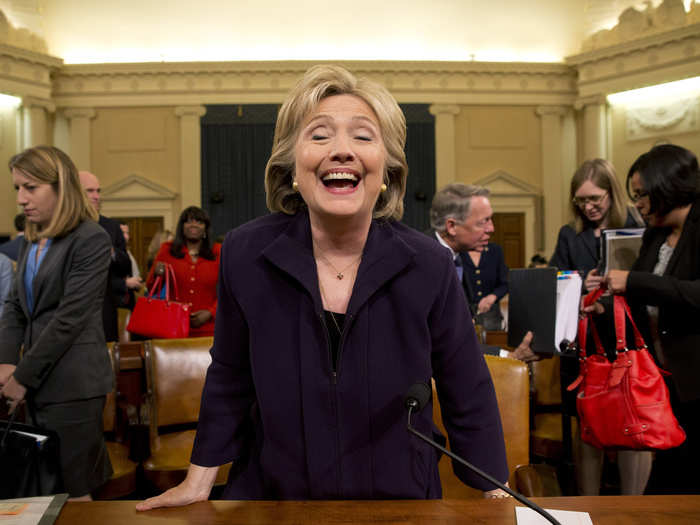 Democratic presidential candidate and former Secretary of State Hillary Clinton laughs as she stands up at the end of her testimony on Capitol Hill in Washington, Thursday, Oct. 22, 2015, before the House Select Committee on Benghazi.