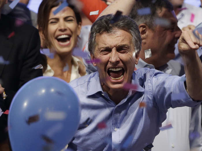 ARGENTINA: In this November 22, 2015, photo, opposition presidential candidate Mauricio Macri and his wife Juliana Awada, back left, celebrate after winning a runoff presidential election in Buenos Aires, Argentina.