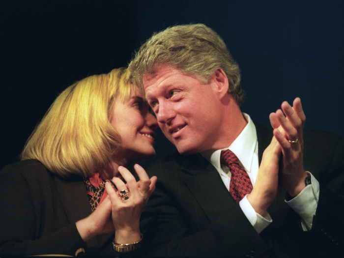 Hillary Clinton whispers to then-President-elect Bill Clinton at a dinner several days before his first inauguration in 1993.