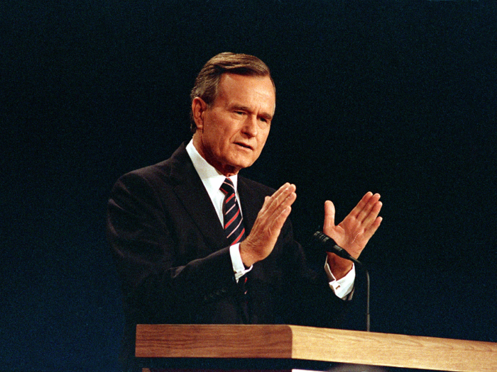 Appearing without his trademark glasses, then-Vice President George H. W. Bush answers a question at the second presidential debate in October 1988.