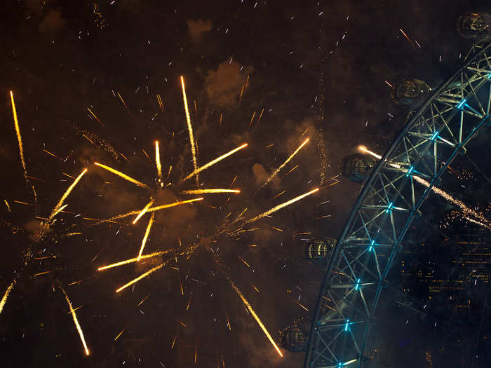 Fireworks explode around the London Eye.