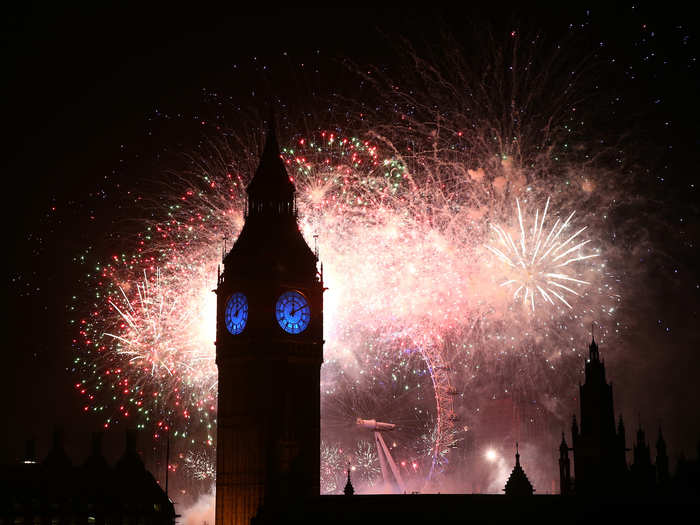 Fireworks light up the London skyline and Big Ben just after midnight.