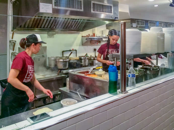 The kitchen is open and bustling — and amazing to watch. You can watch the fresh batches of noodles go from dough to plate in minutes, and all the meat is cooked before your eyes.