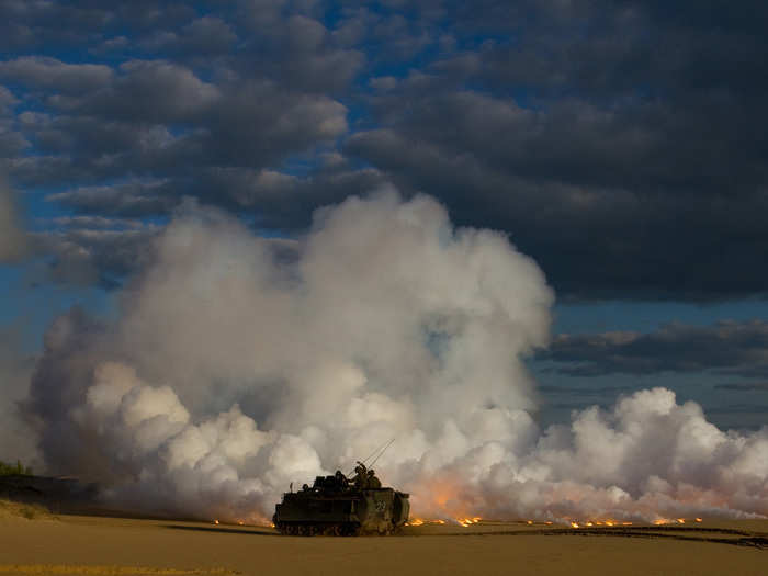 May 22: Lithuanian Land Forces Soldiers from 2nd Coy, Iron Wolf Brigade, fire a smoke screen from an M113A1 Armored Personnel Carrier during a joint live-fire exercise with their American partners, U.S. Army unit Team Eagle, Task Force 2-7 Infantry, held at the Great Lithuanian Hetman Jonusas Radvila Training Regiment, in Rukla, Lithuania. As part of Atlantic Resolve, an ongoing multi-national partnership focused on joint training and security cooperation between the U.S. and other NATO allies, the Soldiers of Team Eagle work with, and around, their Lithuanian, Polish, Portuguese, French and German allies on a daily basis.