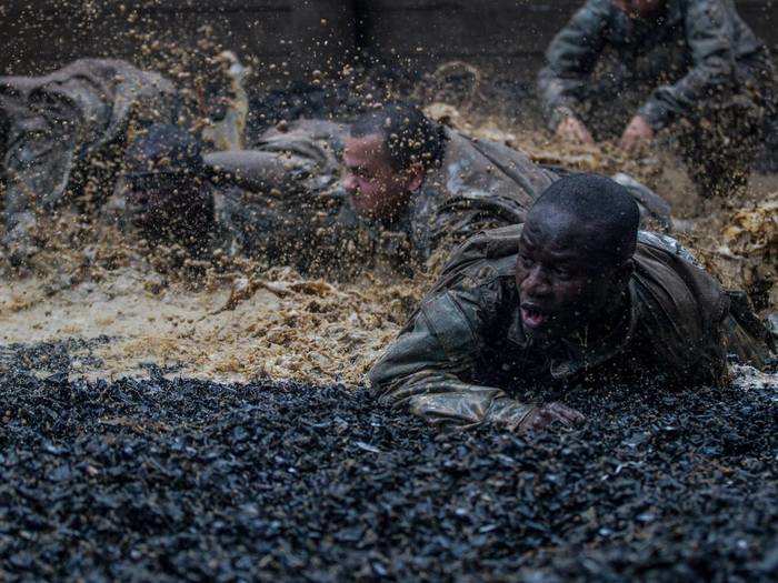 October 1: U.S. Army Soldiers in Basic Combat Training low crawl through the final obstacle during the Fit to Win endurance course at Fort Jackson, S.C.