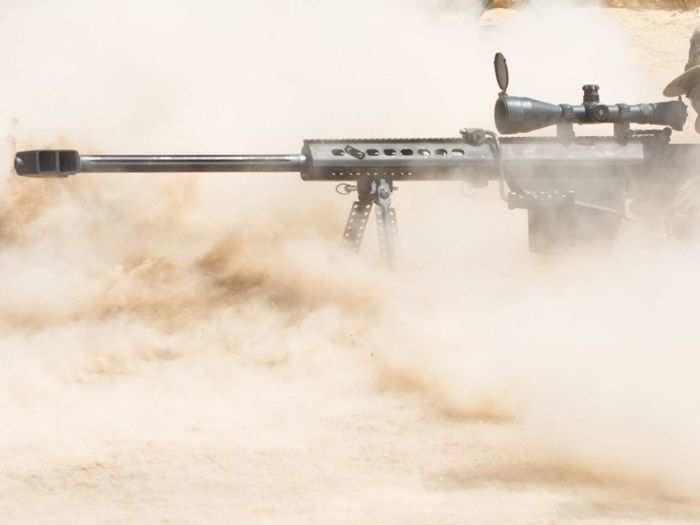 October 14: A Scout Sniper Team Marksman, part of the Recon Platoon from Bravo Company, 2nd Battalion, 124th Infantry Regiment, 53rd Brigade Combat Team, Florida National Guard, fires a Barrett M107 .50 caliber semi-automatic anti-materiel rifle at a 1200-meter target during a live-fire long-range marksmanship training and qualification course at the Arta training range in Djibouti.