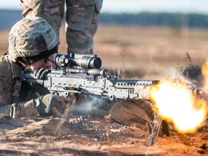 December 2: U.S. Army Spc. Timmy Racke, an infantryman with the 3rd Battalion, 69th Armor Regiment, 1st Armor Brigade Combat Team, 3rd Infantry Division, engages targets with his M240B Machine Gun while conducting battle drills at Pabrade Training Area, Lithuania.