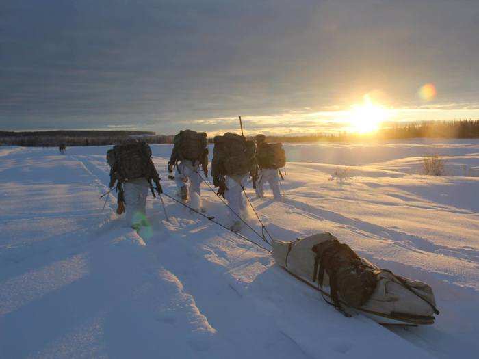 December 10: U.S. Army Soldiers, assigned to 1/25 SBCT "Arctic Wolves", U.S. Army Alaska, transport equipment using snowshoes and ahkio sleds during an arctic mobility squad competition in the Yukon Training Area, Fort Wainwright, Alaska.