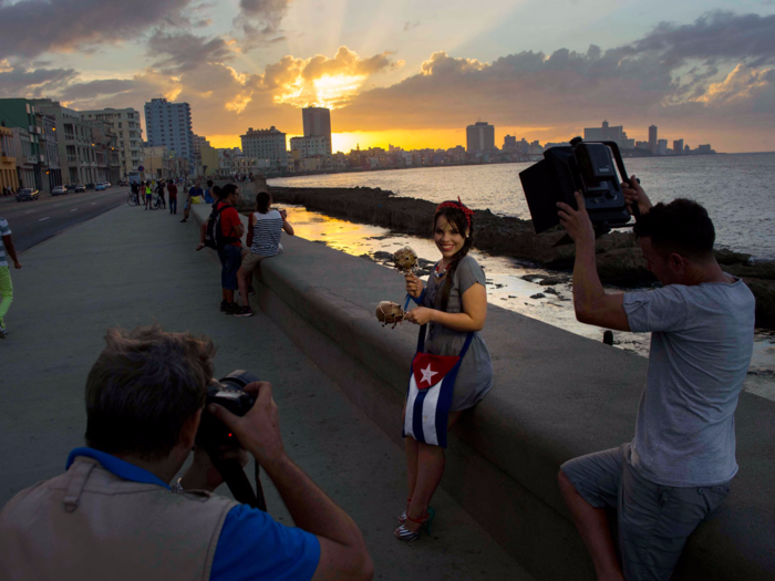 Backdrops for the photos often include scenic destinations like Havana