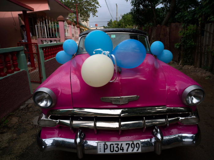 Often, girls will head to their parties in classic American cars decorated in balloons.