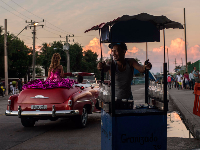 For example, Betancur is pictured here riding in an American convertible to her party in Havana.