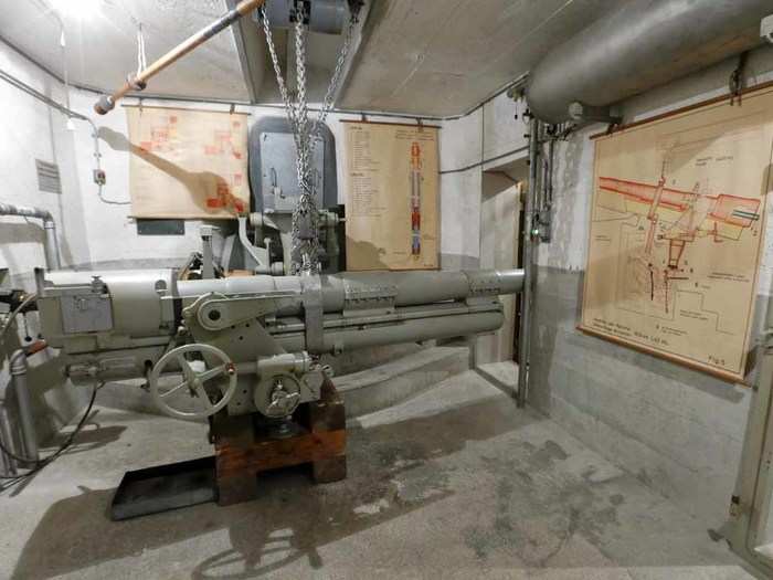 A 10.5cm gun stands unused in a bunker at the Faulensee fort.