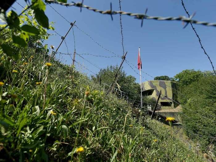 Barbed wire protects the Reuenthal bunker from casual passersby.