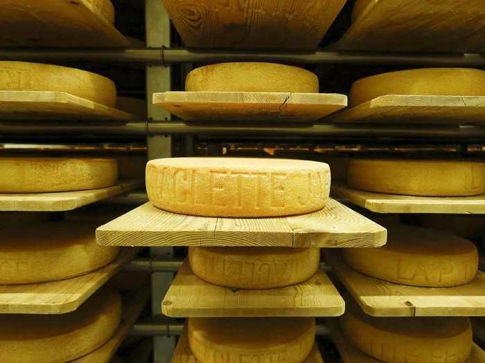 Now this is an unusual second life — the former ammunition bunker in the town of Giswil is now home to a cheese-maker. In this image, large wheels of raclette cheeses made by Swiss cheesemaker Seiler Kaeserei AG mature in storage racks. Raclette is a traditional part of Swiss cuisine.