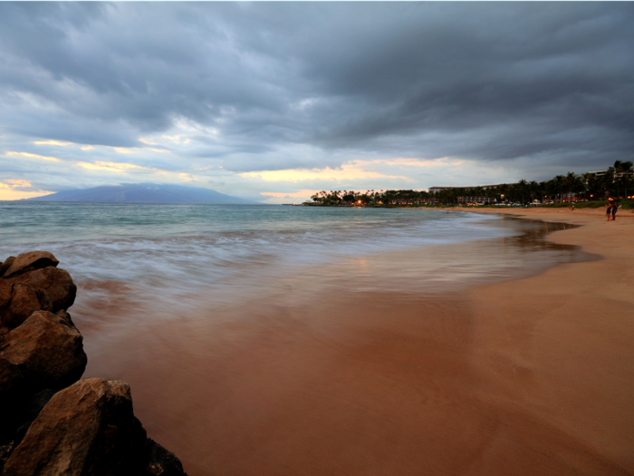Hawaii always brings the magic. Golden-sand Wailea Beach on Maui offers a huge stretch of coastline to stroll, dotted with lava rock and tide pools where you