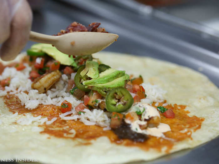 Buttery Hass avocado slices and red tomatillo salsa balanced the heat of the blackened jalapeños, while bacon pieces added a pleasant crunch. Every bite had something new to offer.