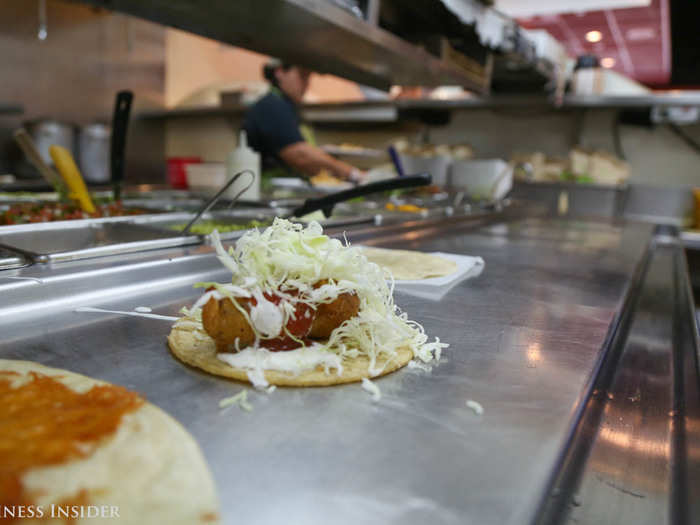 Topped with mild salsa, fresh cabbage, and a white sauce that Marc says some customers drink by the four-ounce cup, the taco became a thing of beauty.