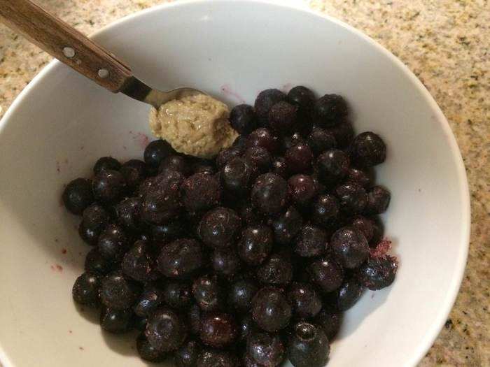 For dessert, I have a bowl of frozen blueberries with a spoonful of cashew butter.