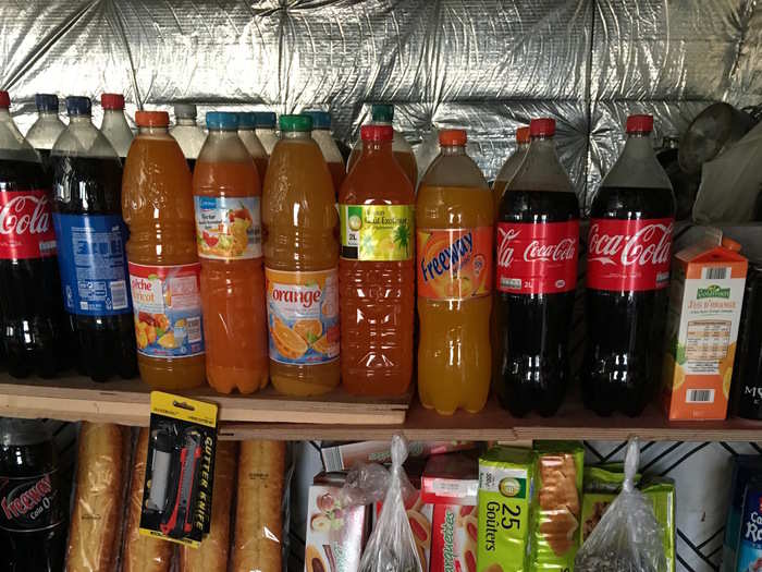 The shopkeepers go to nearby French supermarkets to stock up.