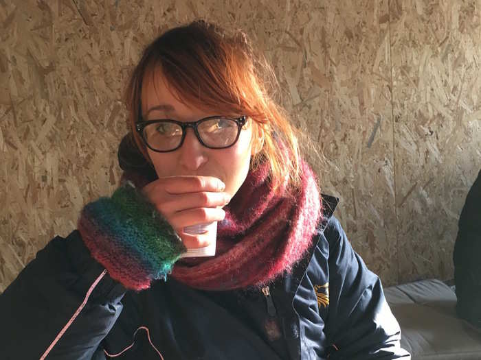 Annie, one of the volunteers for Help Refugees, drinks Chai tea at a cafe.