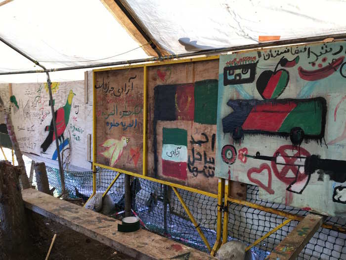 These flags and drawings tell their own story. See the cross-out machine gun on the right.