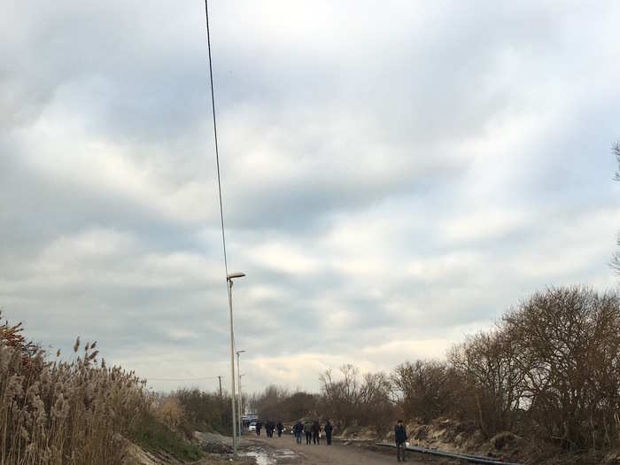 One of the roads next to the camp which leads to the Jules Ferry centre where food is distributed to everyone and people can charge their phones.