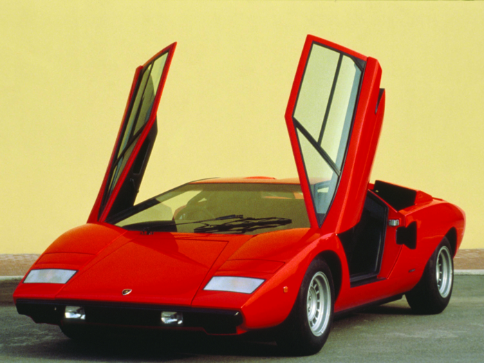 The first car anyone thinks of when it comes to crazy doors would be the Lamborghini Countach and its upswinging scissor doors. It