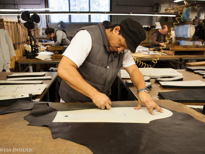 For leather, the process is somewhat different. The leather cutters cut the leather pieces into the shapes for the jackets using a knife and a polymer plastic stencil.