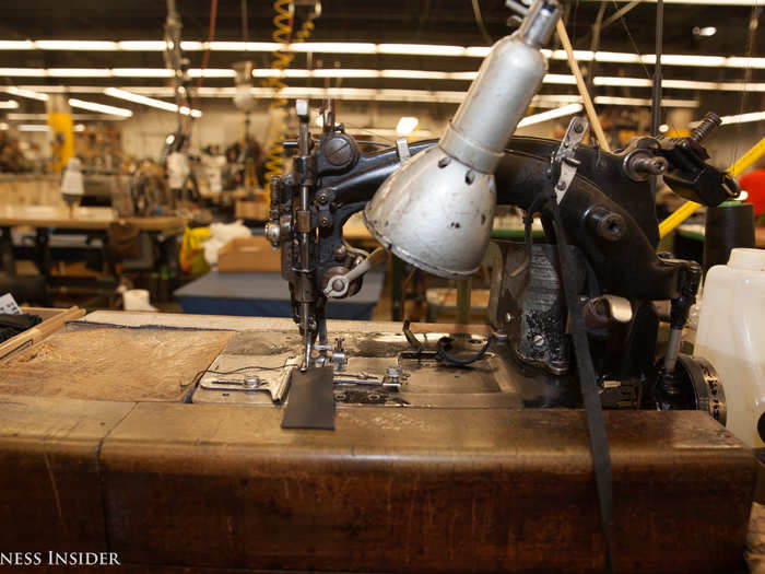 Some of the machines are extremely old, and when they break, a part must be custom-made to fix it. This one is nearly 100 years old and stitches a very delicate part of the jacket — the belt loops. Only the mechanic is allowed to operate it.