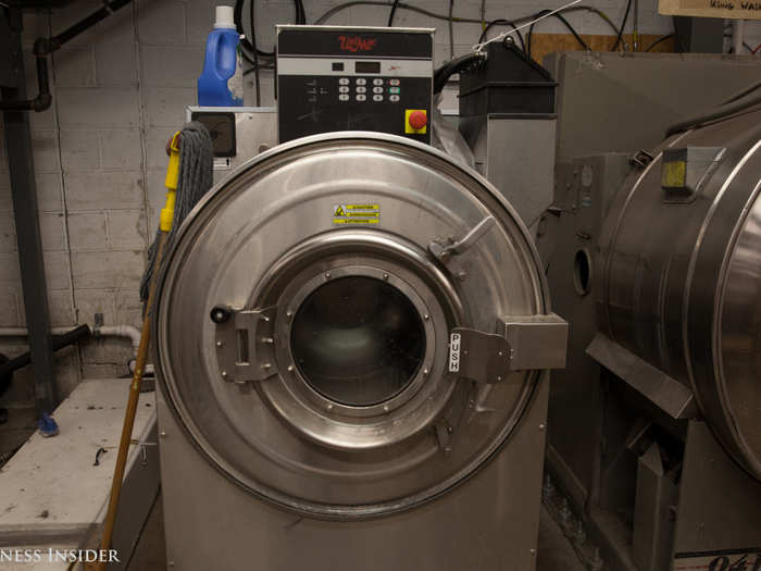 At this stage, some jackets could also be put in this industrial tumble washer with stones before being tagged. Tumbling around with the stones will break the leather in faster, allowing the jacket to conform to the owner