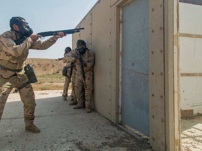 As chemical warfare is a reality in Iraq and Syria, the soldiers practice operations while wearing gas masks.