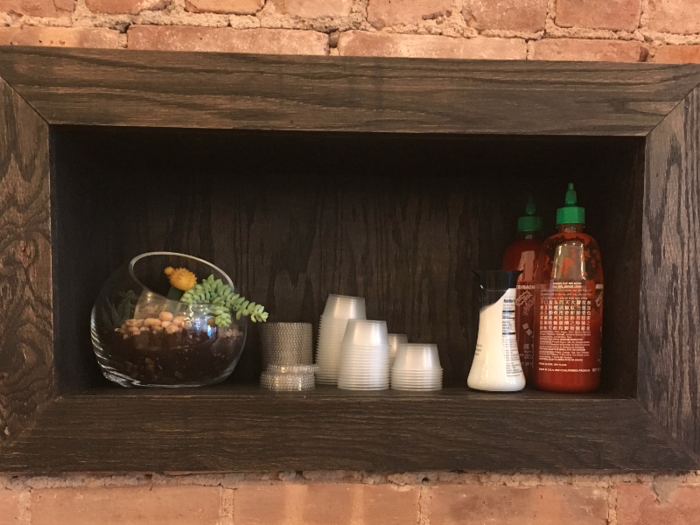 There are lots of sweet little details, like the plant in this Sriracha nook.