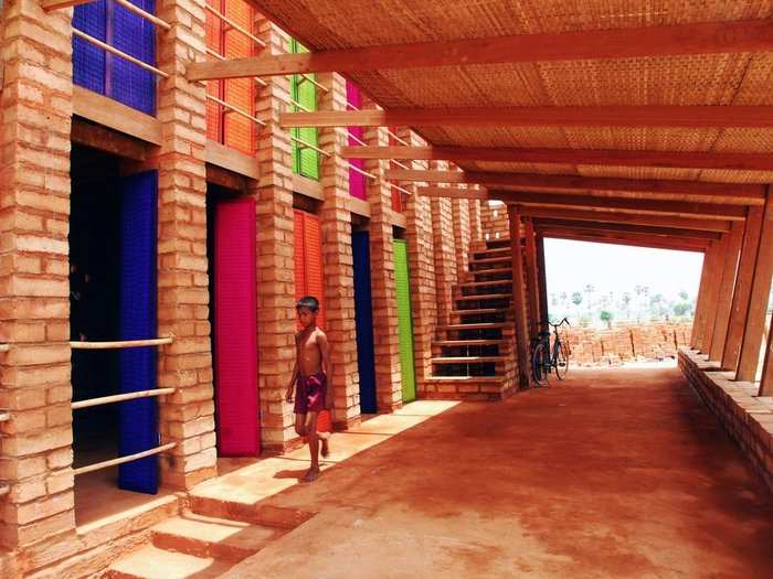 Colors pop at the Sra Pou Vocational School in Cambodia. Villagers can visit the brick building to learn arithmetic? or how to start a small business.