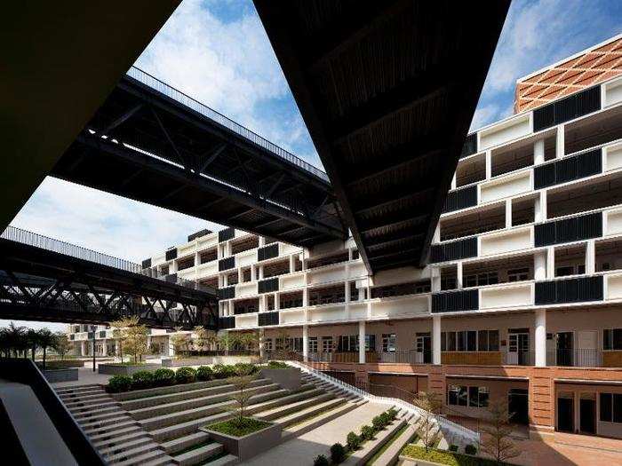 Its crisscrossing skywalks throw cooling shadows onto the campus below.