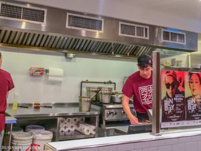 You wait for your food at the end of the kitchen, watching it cook from pan to plate. The wait was a tad long —maybe eight minutes — but to be fair, it was wildly busy at the time.