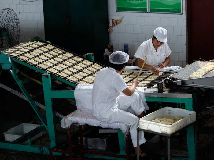 These workers are helping package instant noodles in the village of Nanjie.