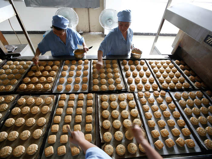 Chinese moon cakes, which are being processed here, are usually eaten around Zhongqiujie, or, the Mid-Autumn Festival. They