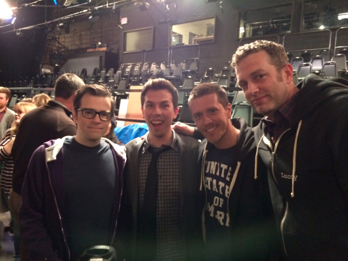 8:45 p.m. PT: Weezer frontman Rivers Cuomo, far left, hangs out with the writers during the after show party on-stage.