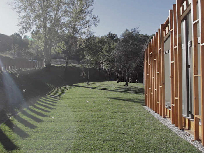 The contemporary design includes some unusual elements, like this wooden latticework exterior.