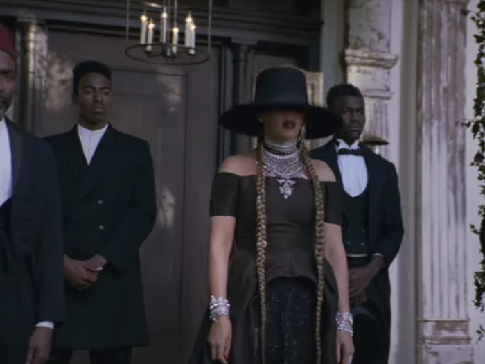 ...and Beyoncé and others dressed in all black.
